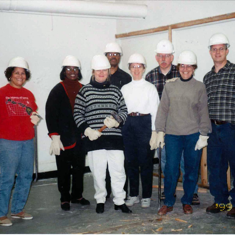 Staff and faculty pose during Day of Caring in 1999.